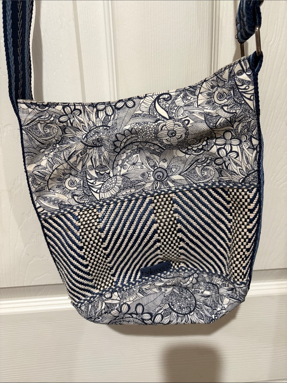 Sakroots Crossbody Bag in Navy and White Floral & Striped Pattern -